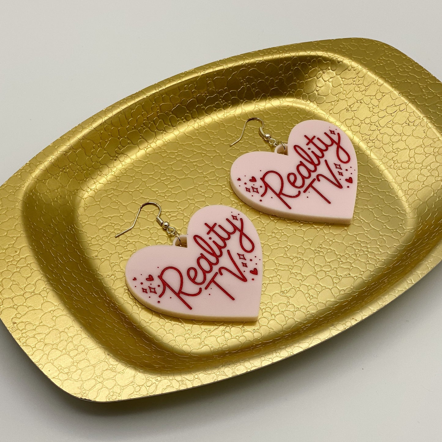 reality tv heart earrings