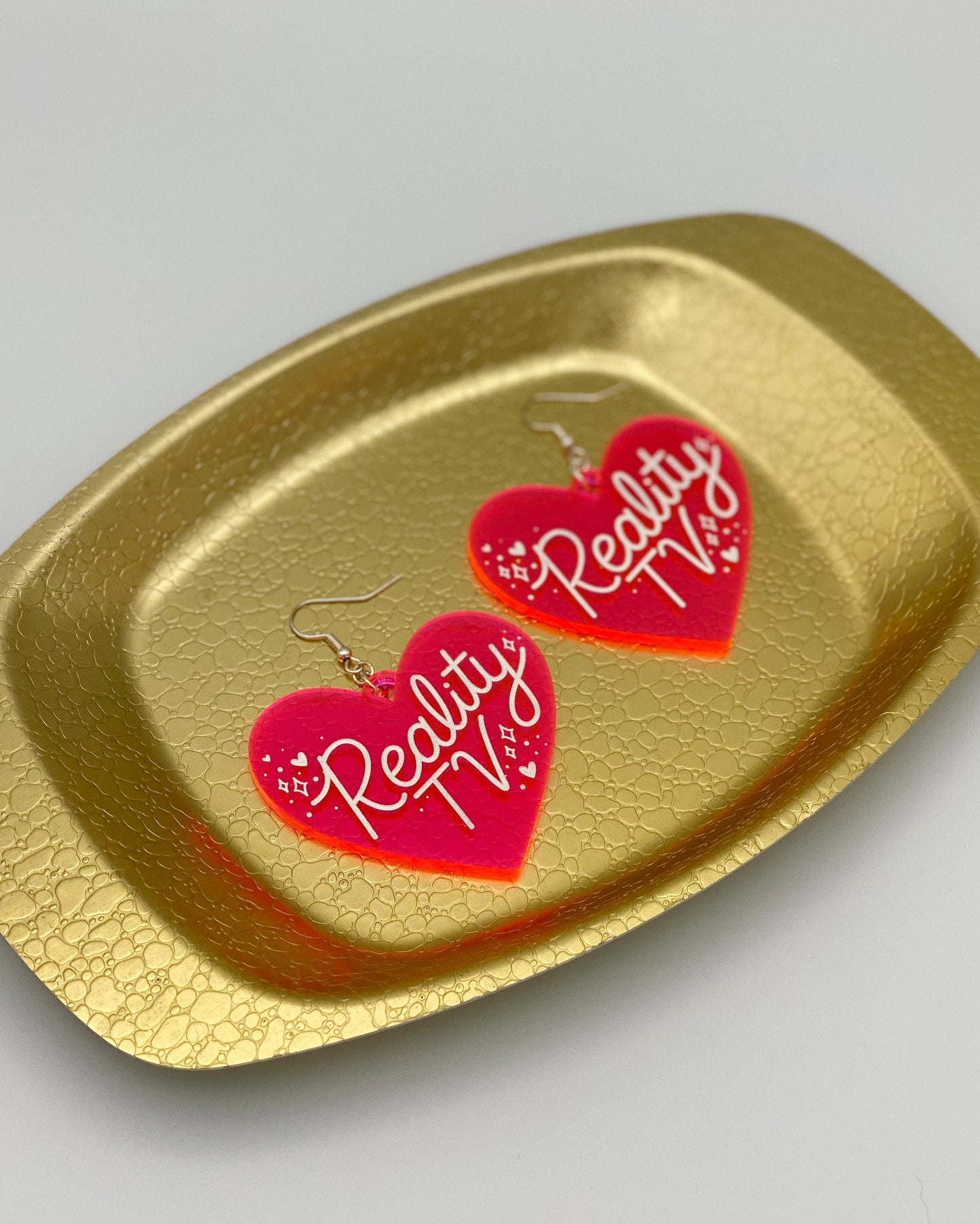 reality tv heart earrings